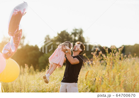 Father's day. Happy family daughter hugs his dad on holiday Father's day. Happy family daughter hugs his dad on holiday 64700670