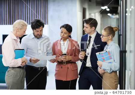 Business people preparing for meeting Business people preparing for meeting 64701730