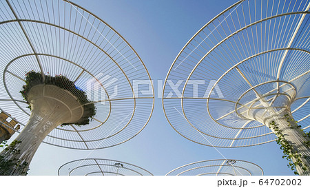 Futuristic metal flowers in Dubai Miracle Garden Park. 64702002