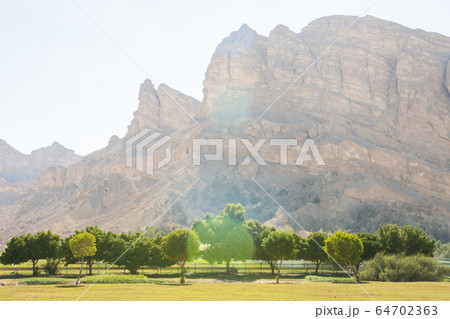 Mountains near the hot thermal springs in the United Arab Emirates near Ain Al. Mountains near the hot thermal springs in the United Arab Emirates near Ain Al. 64702363