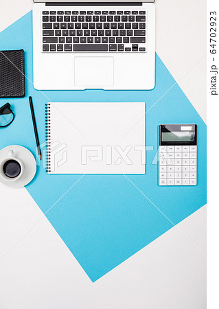 School and office supplies lie neatly on a white and blue background 64702923