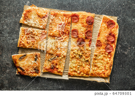 Pieces of homemade Italian pizza. 64709301