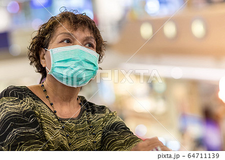Old asian woman in a mask for COVID-19, 64711139