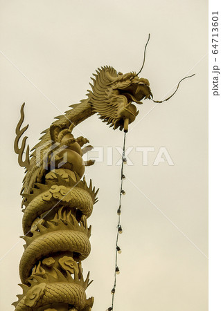 Golden dragon statue on high. Golden dragon statue on high. 64713601
