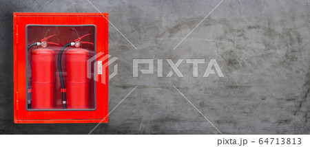Fire Extinguisher in red cabinet on concrete wall Fire Extinguisher in red cabinet on concrete wall 64713813