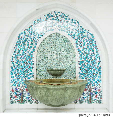 Tiled ornament drinking water fountains on forecourt of islamic mosque Tiled ornament drinking water fountains on forecourt of islamic mosque 64714893