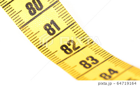 Close-up of a yellow measuring tape isolated on 64719164