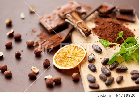 chocolate with hazelnuts, cocoa beans and orange chocolate with hazelnuts, cocoa beans and orange 64719820