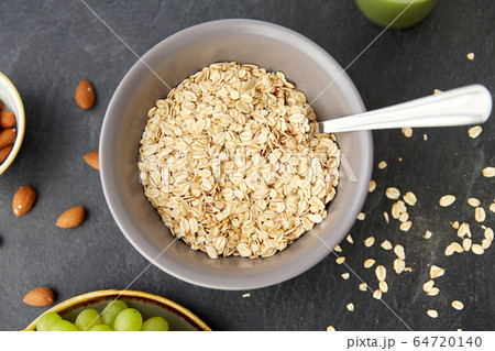 oatmeal cereals in bowl with spoon oatmeal cereals in bowl with spoon 64720140