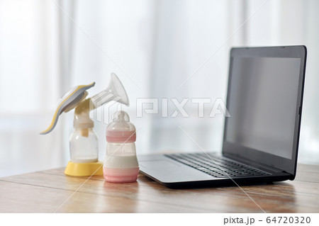 baby milk formula, breast pump and laptop baby milk formula, breast pump and laptop 64720320
