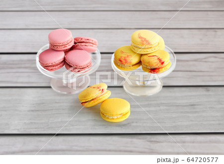 macaroons on glass confectionery stand 64720577