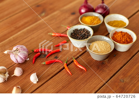 spices, onion, garlic and red hot chili peppers 64720726