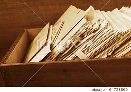 Old postal mails in a wooden box 64723660