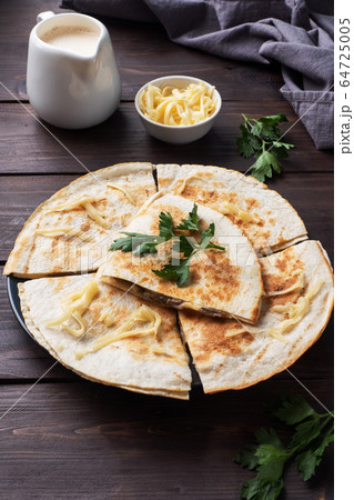 Pieces of quesadilla with mushrooms sour cream and Pieces of quesadilla with mushrooms sour cream and 64725005