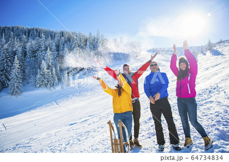 Friends Have Fun At Winter On Fresh Snow 64734834