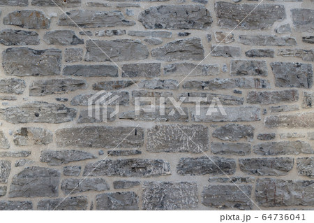 Old weathered granite stone wall textured natural background Old weathered granite stone wall textured natural background 64736041