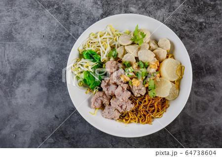 noodles with pork and meat balls 64738604