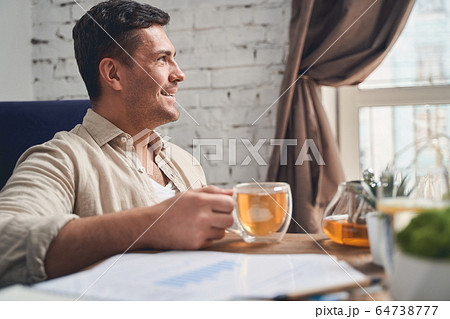 Joyous telecommuter taking a break from work Joyous telecommuter taking a break from work 64738777