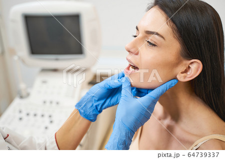 Close up of pretty woman that opening her mouth 64739337