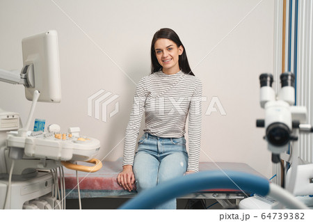 Cute longhaired girl waiting for her doctor Cute longhaired girl waiting for her doctor 64739382