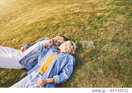 Loving young man kissing his girlfriends hand Loving young man kissing his girlfriends hand 64739522