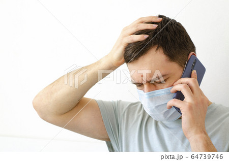 Coronavirus. Quarantine. A man solves work issues Coronavirus. Quarantine. A man solves work issues 64739746