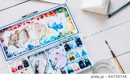 artist workplace watercolor palette paintbrush 64739748
