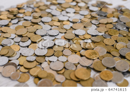 Shape of ukrainian money coins on table 64741615