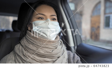 Tired Female Doctor Drives A Car After A Hard Day's Work Tired Female Doctor Drives A Car After A Hard Day's Work 64743823
