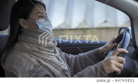 Asian Woman Holds A Steering Wheel Driving Car Asian Woman Holds A Steering Wheel Driving Car 64743831