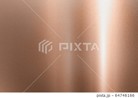 Light shining down on  bronze hard metal wall with 64746166