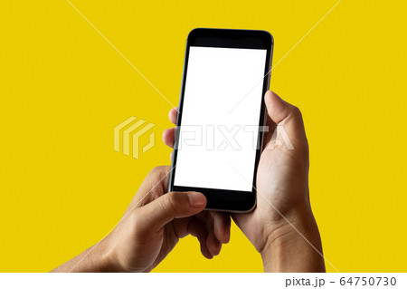 Hand holding white mobile phone with blank white screen Yellow background. Hand holding white mobile phone with blank white screen Yellow background. 64750730