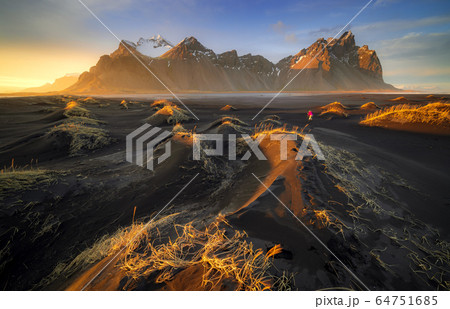 Vestrahorn mountain with black volcanic lava sand Vestrahorn mountain with black volcanic lava sand 64751685