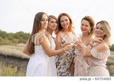 The company of female friends enjoys a summer 64754063