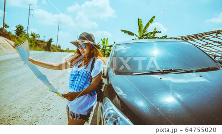 woman travel relaxing nature mountain map navigation. Travel relax in the holiday. View map travel woman travel relaxing nature mountain map navigation. Travel relax in the holiday. View map travel 64755020