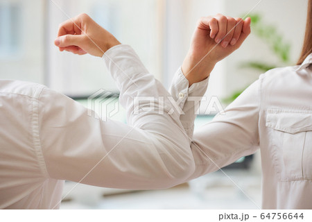 Elbow greeting to avoid the spread of coronavirus, covid 19.  64756644