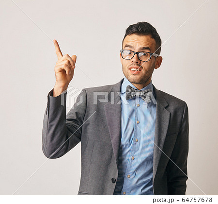 Young smiling man having a good idea Young smiling man having a good idea 64757678