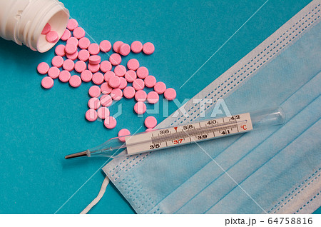 Pink pills, glass mercury thermometer, face mask 64758816