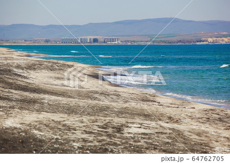 Beach and sea in bright sunlight Beach and sea in bright sunlight 64762705
