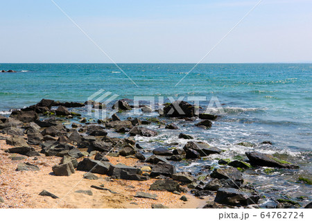 Beach and sea in bright sunlight Beach and sea in bright sunlight 64762724