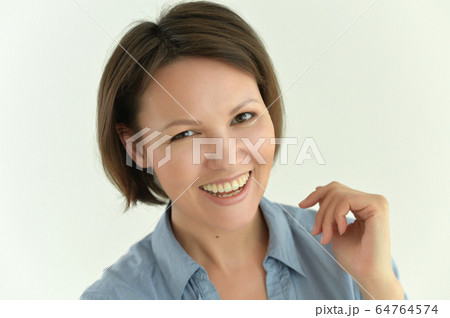 Portrait of beautiful young woman posing isolated 64764574
