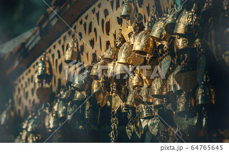 Many brass bells hanging on temple roof Many brass bells hanging on temple roof 64765645
