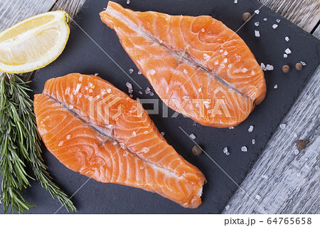 Two fresh raw salmon butterfly steaks 64765658
