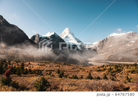 Scenery of mount Assiniboine with lake Magog and Scenery of mount Assiniboine with lake Magog and 64767580