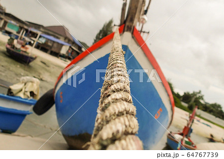 fishing boat wooden dark blue and red moored to fishing boat wooden dark blue and red moored to 64767739