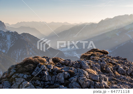 Hiking view val di fassa sunset lonely mood sun rays sunset mist horizon 64771118