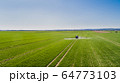 Tractor Spraying Herbicides on Field Agriculture 64773103