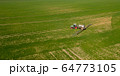 Agriculture Tractor Working in Field 64773105