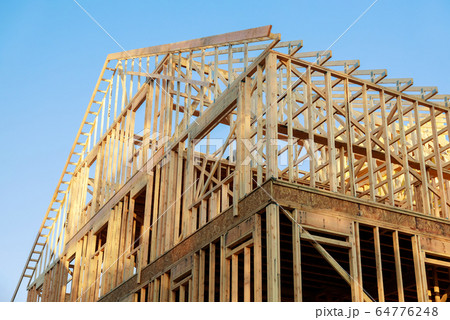 Wooden house roof frame structure on a new 64776248
