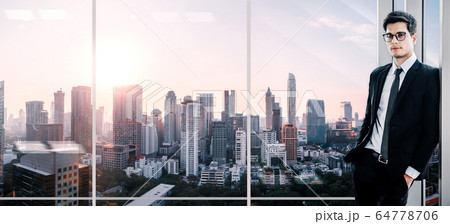 Business man on office skyline city 64778706